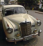 An Old Mercedes Benz in Luang Prabang by Asienreisender